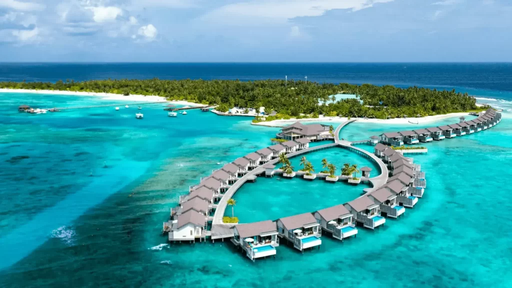 Aerial view of an overwater villa in the Maldives with hotel deals in Maldives