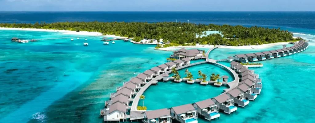 Aerial view of an overwater villa in the Maldives with hotel deals in Maldives